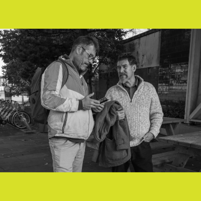 Two males talking outside